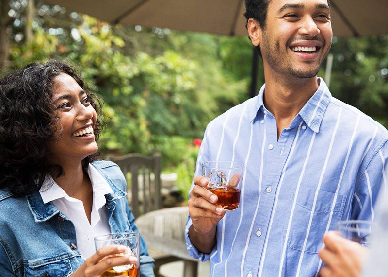 Couple Talking with drinks in hand