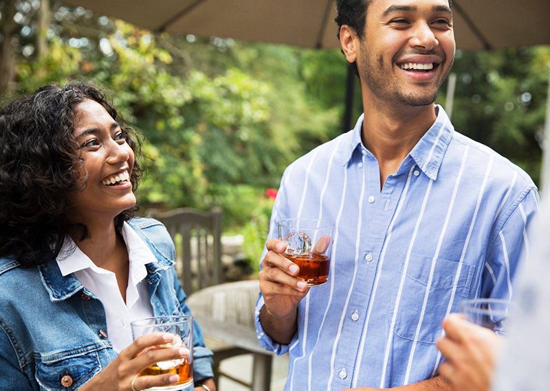 People drinking and laughing