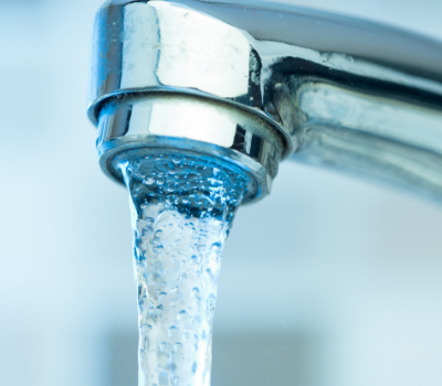 water pouring from a sink faucet