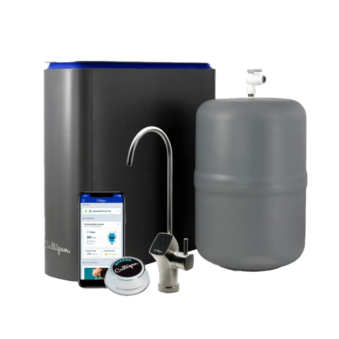 A Culligan under-sink water filtration system, featuring a dark grey main unit, a grey pressure tank, a brushed metal faucet, a smartphone displaying the Culligan app, and a small round smart monitor, all on a black background.