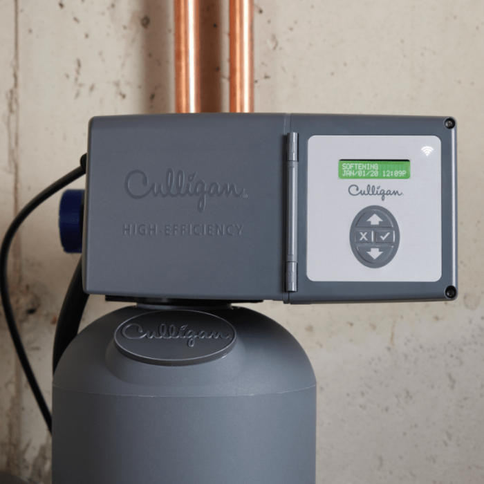 A gray Culligan High-Efficiency water softener unit with a digital display showing 