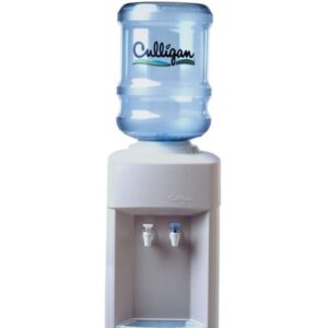 A Culligan water cooler with a large blue water bottle on top of a light gray dispenser unit, featuring two spigots and a drip tray with the Culligan logo.