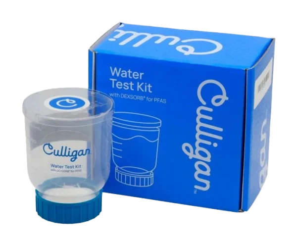 A Culligan Water Test Kit, including a clear plastic sample container with a blue base and a blue cardboard box, both branded 'Culligan' and indicating 'Water Test Kit with DEXSORB® for PFAS', against a black background.