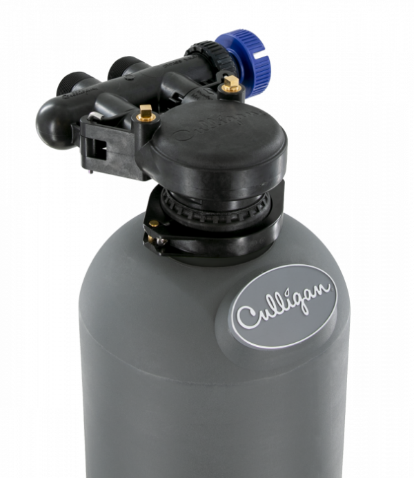 Top portion of a gray Culligan water treatment tank with a black control head and a blue adjustment knob, against a black background.