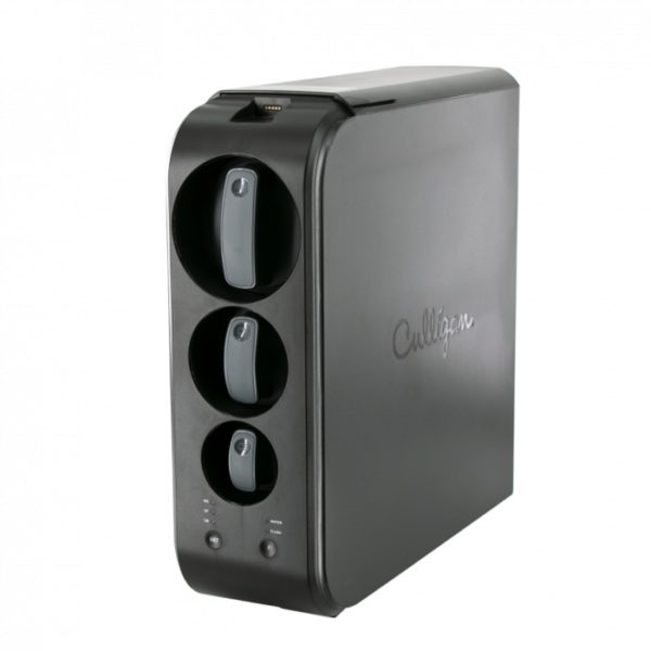 A dark gray Culligan water filtration system with three visible filter slots and control buttons, against a black background.