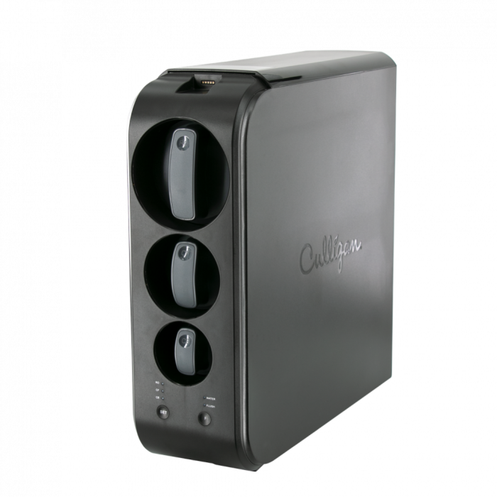 A dark gray Culligan water filtration system with three visible filter slots and control buttons, against a black background.
