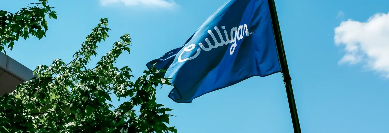 Culligan flag waving in front of a blue sky